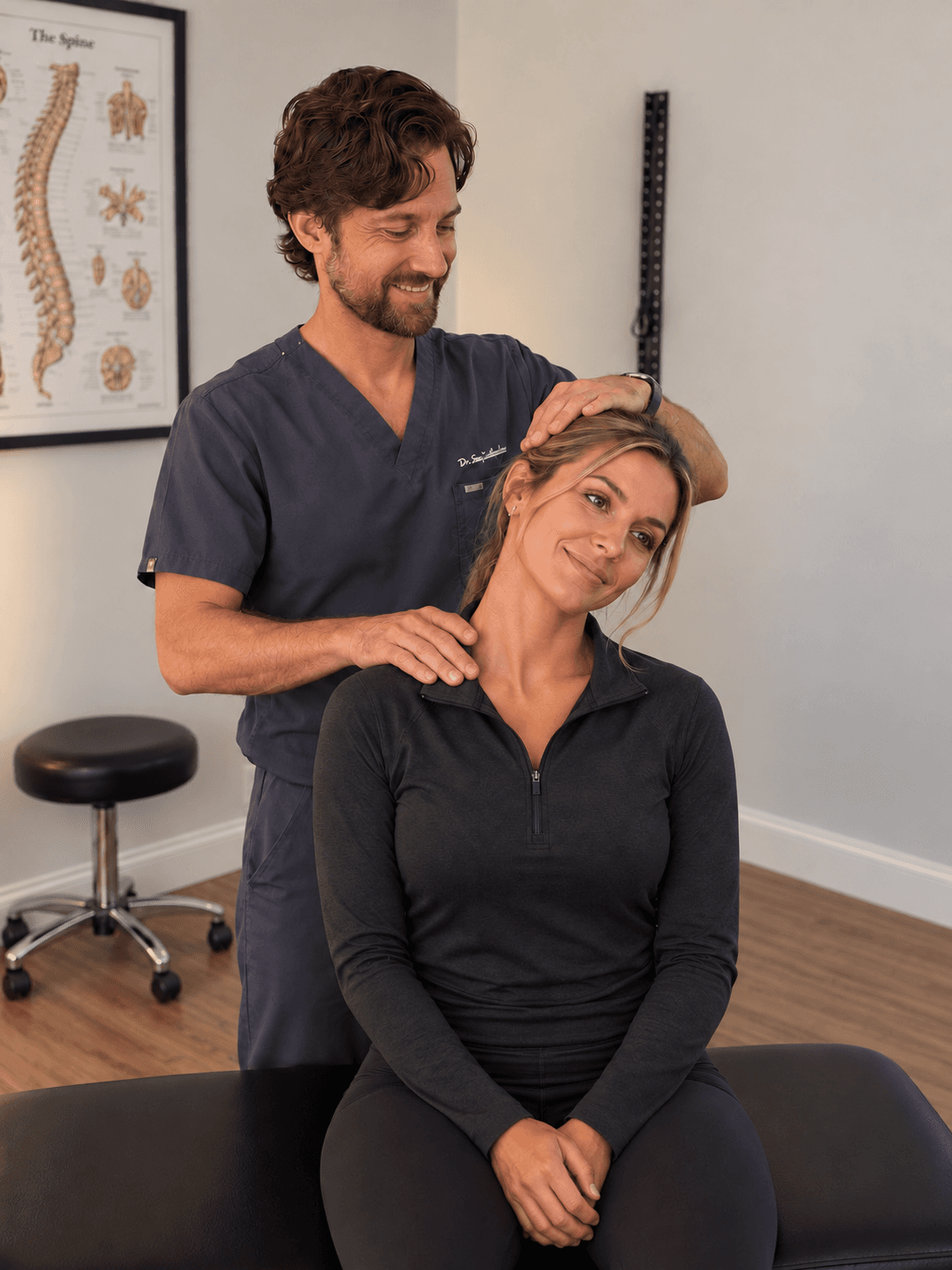 Dr. Shawn Johnston providing a seated neck adjustment at Relief Plus