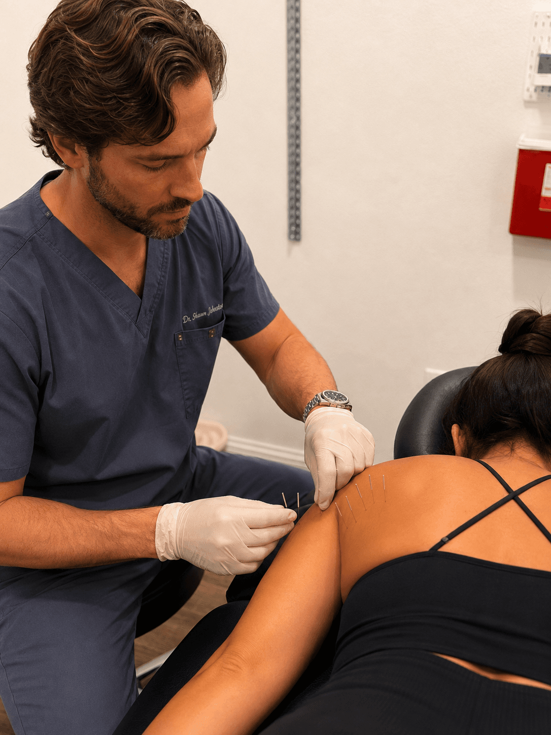 Shawn D. Johnston, D.C., performing dry needling for a patient’s shoulder at Relief Plus