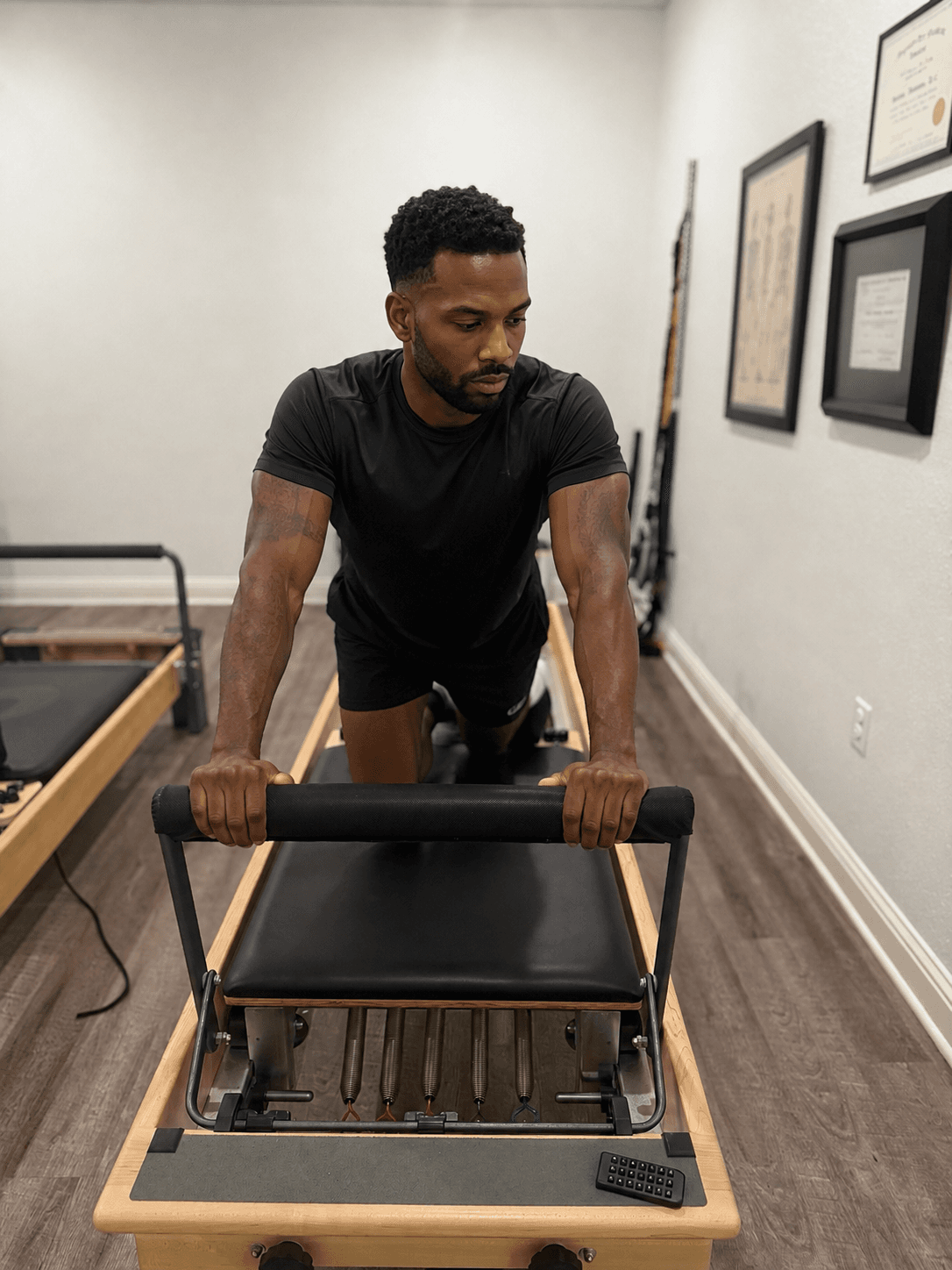Patient performing a controlled reformer exercise at Relief Plus